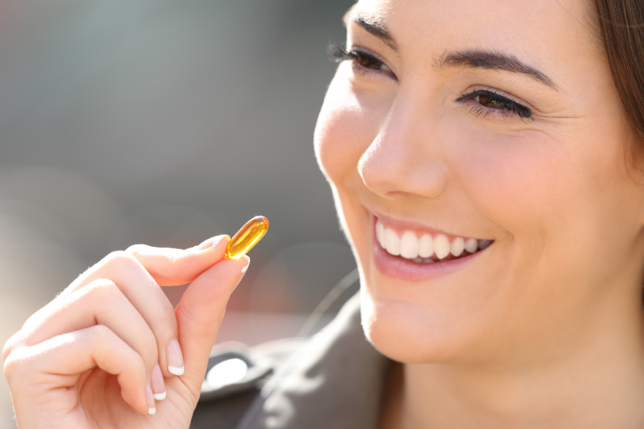 woman taking omega-3 supplement