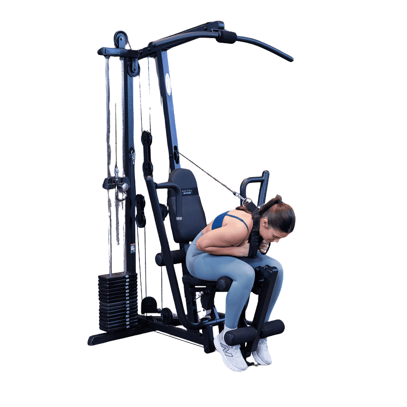 Woman on Body Solid Multigym doing crunches