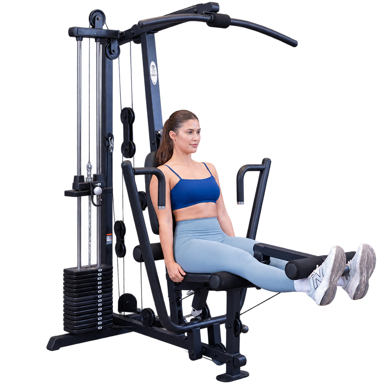 woman performing leg extension on body solid G1B